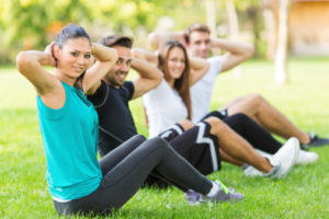 Group of people exercising in park