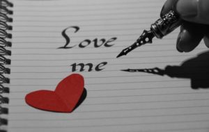 Calligraphy pen writing "love me"